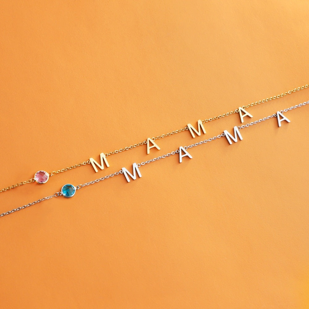 Gold initial necklace with letter charms M A and blue/purple bead stones