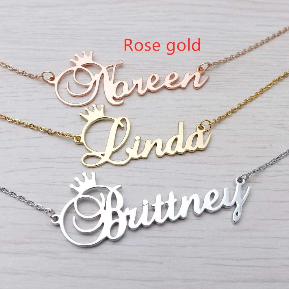 Rose gold engraved initial necklace with crown pendant, letter Noreen on chain