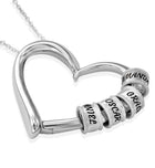 Silver heart name pendant necklace with engraved bead charms on a chain