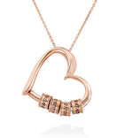 Rose gold heart name pendant necklace with stacked engraved beads on a chain