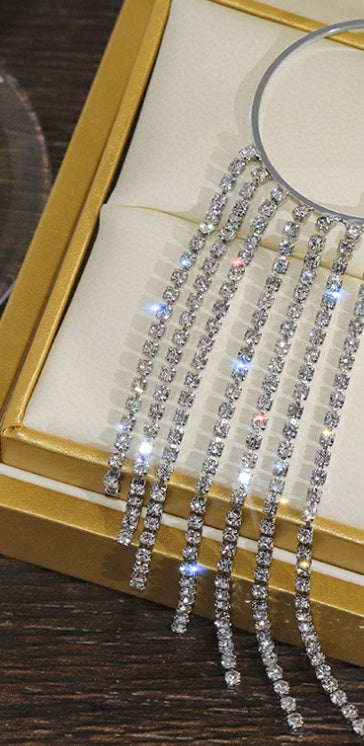 Silver hoop earrings with sparkling rhinestone vertical fringe strands