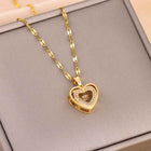 Gold heart pendant necklace with stone-inset heart charm on a link chain