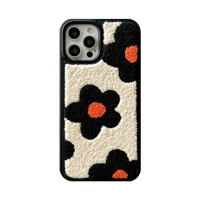Plush floral iPhone case, cream and black with orange flower centers; raised camera cutouts