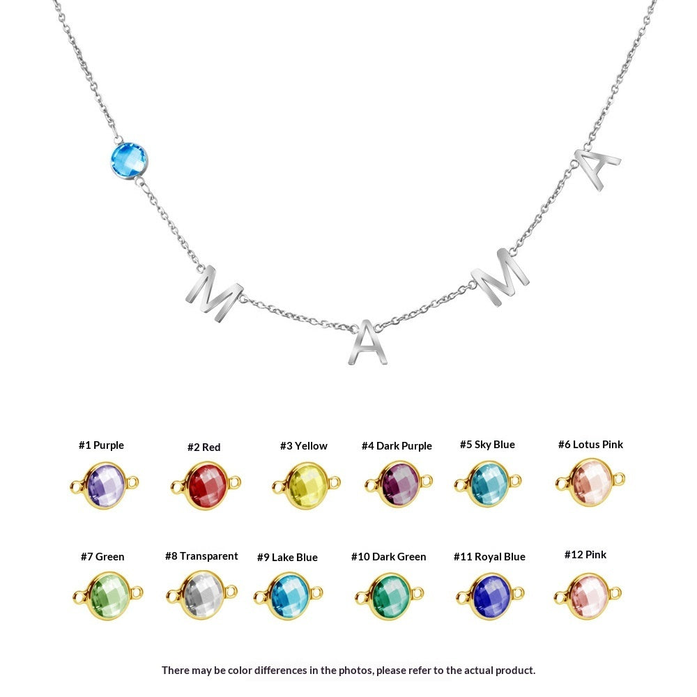 Silver initial necklace with letter charms and a round blue stone pendant