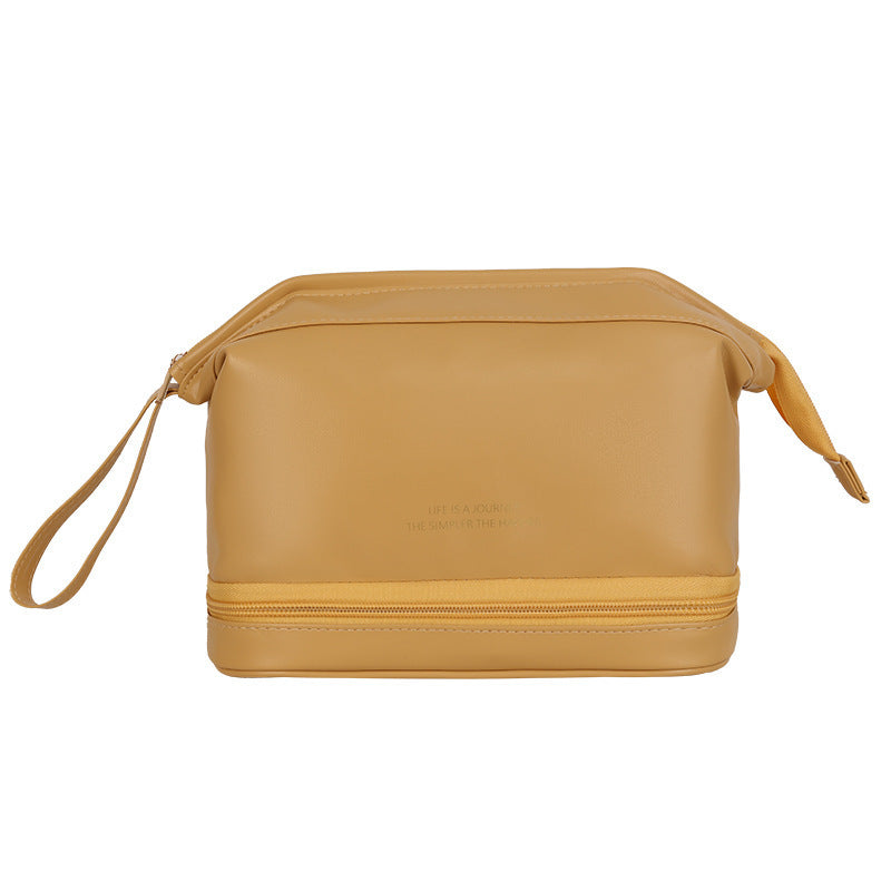 Tan double-layer travel cosmetic bag with side draw straps and top zipper