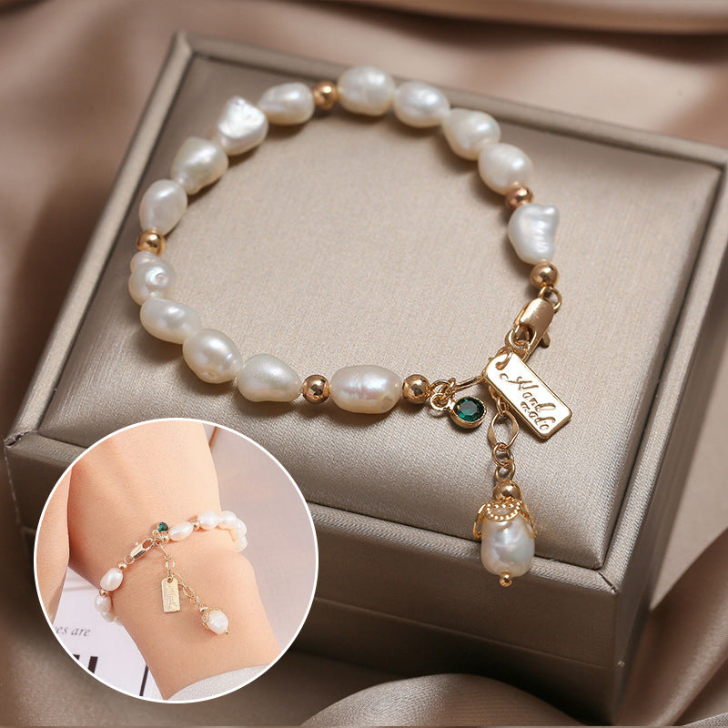 Gold pearl bracelet with zircon charm and small dangling pearl drop