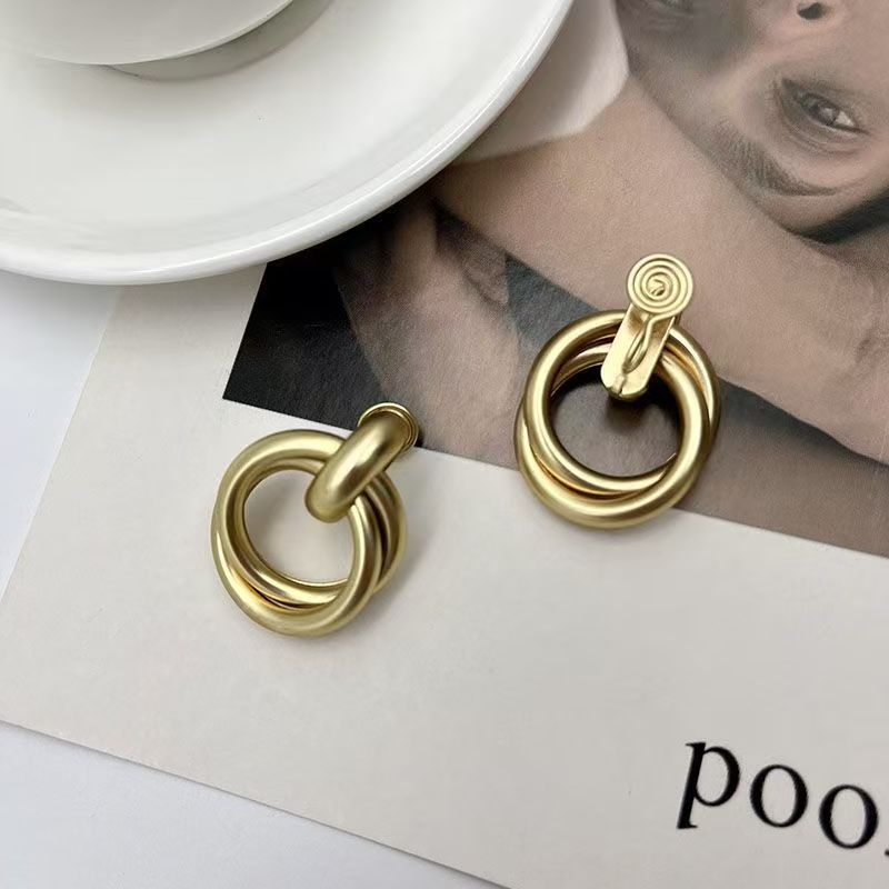 Gold circular statement earrings with twisted baroque metal rings