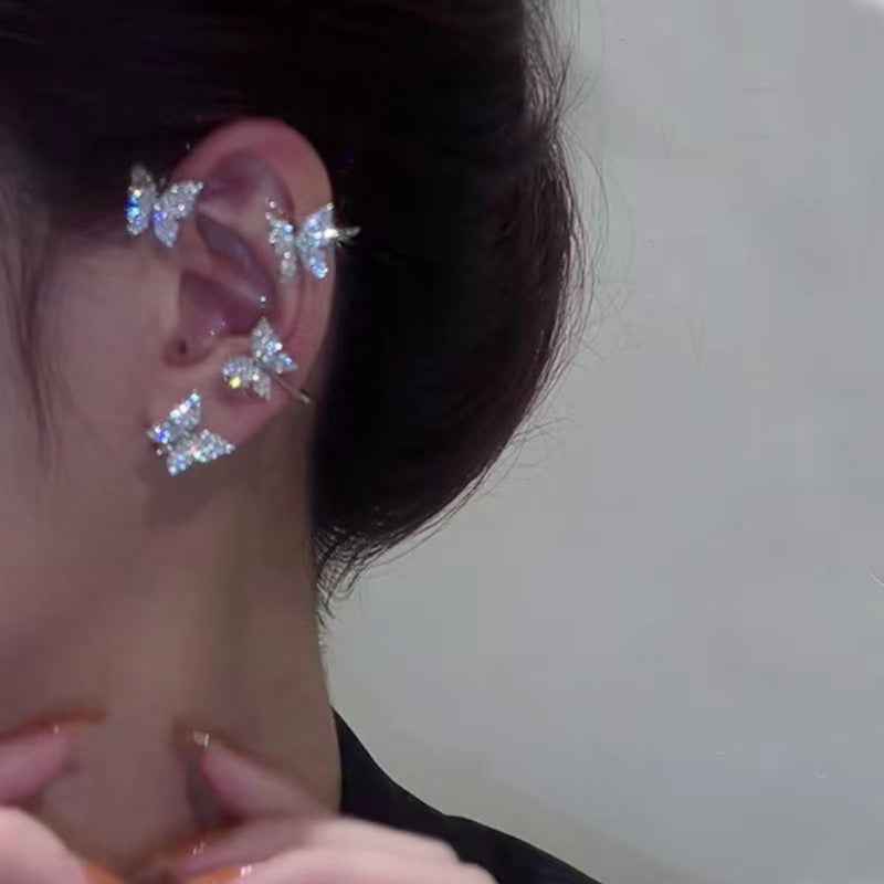 Blue butterfly stud earrings with crystal-like sparkle