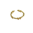 Gold-tone adjustable open bow link ring with scalloped clasp detail