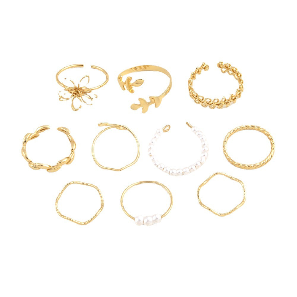 Gold-tone openwork rings set with pearl beaded bands and mixed motifs