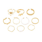 Gold-tone openwork rings set with pearl beaded bands and mixed motifs