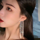 Long tassel drop earrings with silver rhinestone fringe and small stud tops