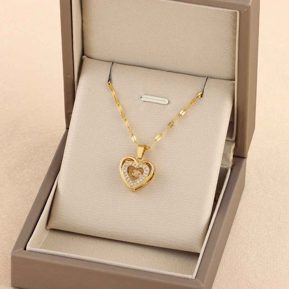 Gold heart pendant necklace in a gift box, with stone heart charm on link chain