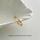 Gold-tone open bow link ring with adjustable clasp, minimalist design