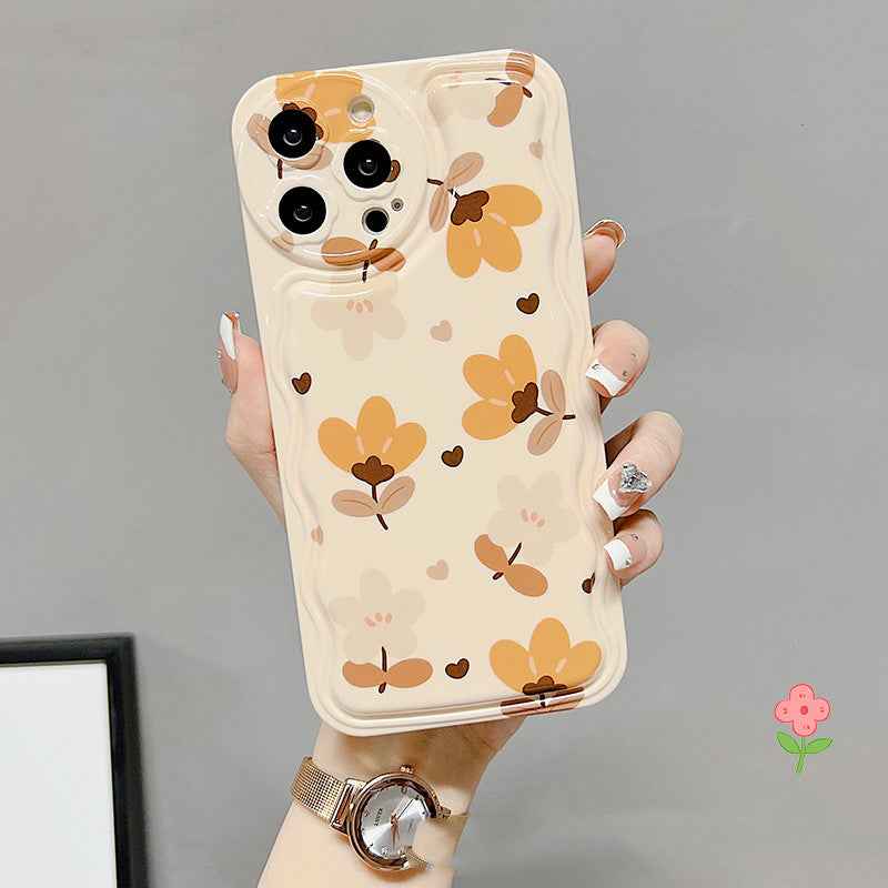 Floral phone case with bear-and-flower print, ring holder, and clear bow charm