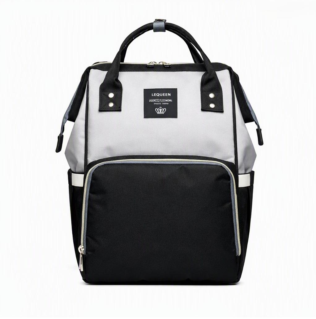Light gray diaper backpack with black front pocket and top carry handles
